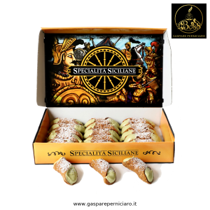 Cannoli mignon al pistacchio artigianali siciliani disposti in confezione elegante, con cialda croccante e crema di pistacchio vellutata, pronti da gustare.