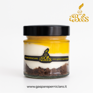 Cheesecake artigianale all’arancia siciliana in vasetto di vetro, preparata con Arance di Ribera DOP e crema vellutata, dolce gourmet ideale per ristoranti e locali premium.